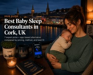 Sleeping baby in a Cork, Ireland nursery with soft window light over the River Lee at dawn, baby sleep consultant scene