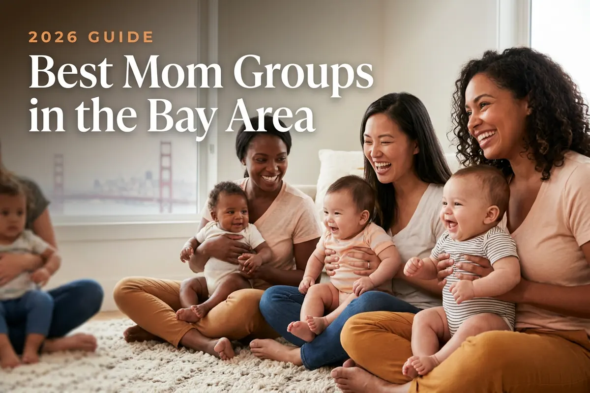 Three diverse moms holding their babies at a welcoming mom group meetup in San Francisco Bay Area, with the San Francisco skyline with the Golden Gate Bridge in soft morning light behind them, illustrating a guide to the best mom groups in the Bay Area for 2026