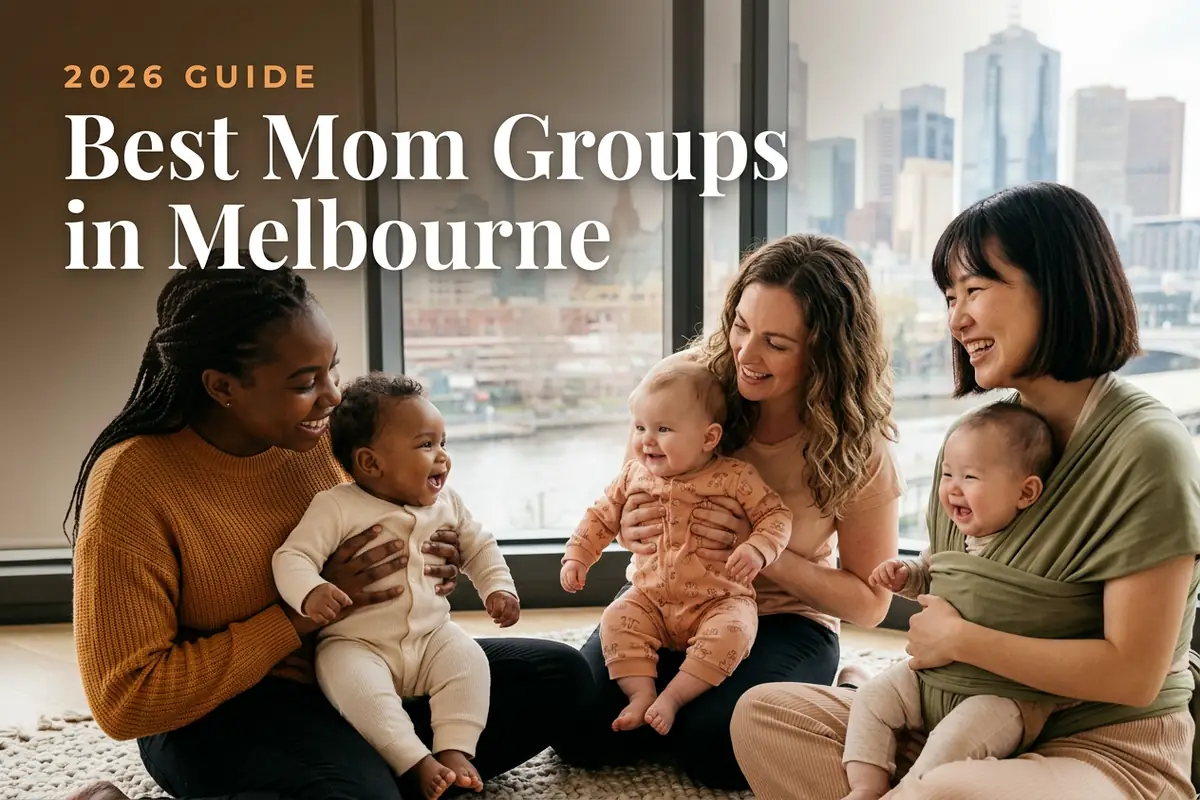Three diverse moms holding their babies at a welcoming mom group meetup in Melbourne, with the Melbourne skyline along the Yarra under soft, changeable daylight behind them, illustrating a guide to the best mom groups in Melbourne for 2026