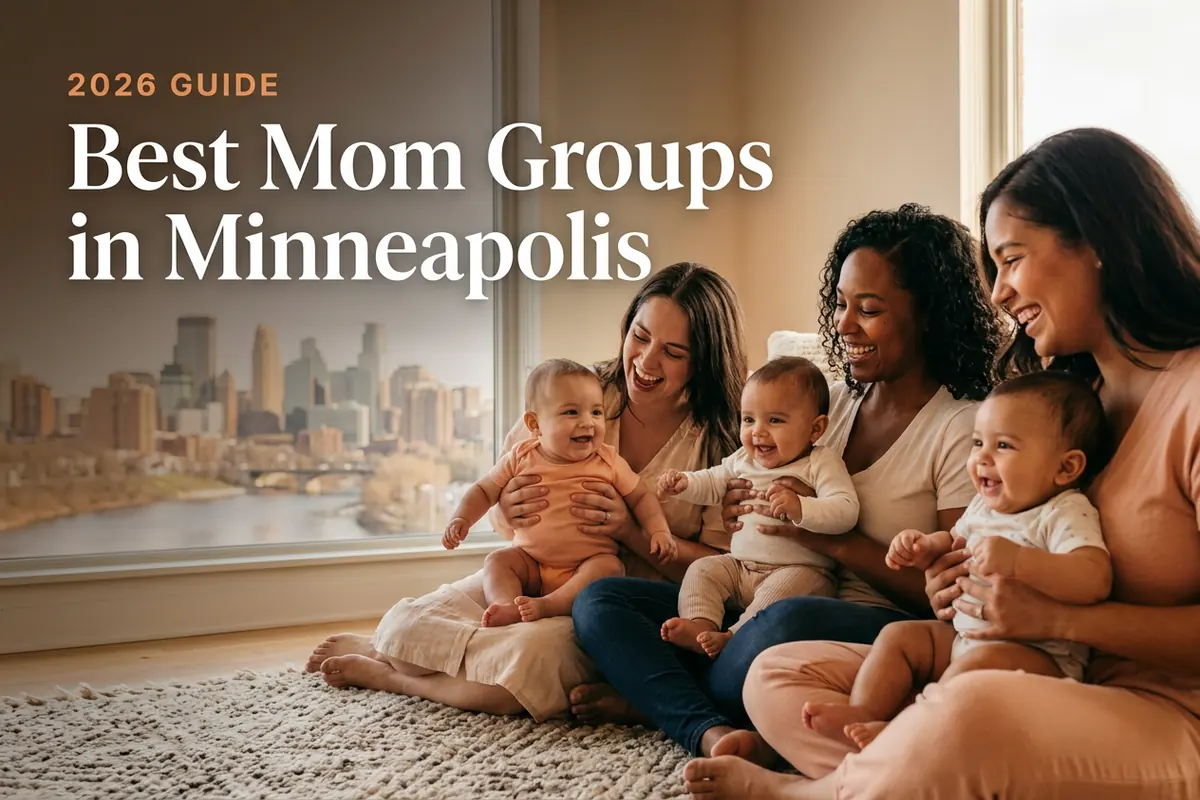 Three diverse moms holding their babies at a welcoming mom group meetup in Minneapolis, with the Minneapolis skyline above the Mississippi River in warm daylight behind them, illustrating a guide to the best mom groups in Minneapolis for 2026