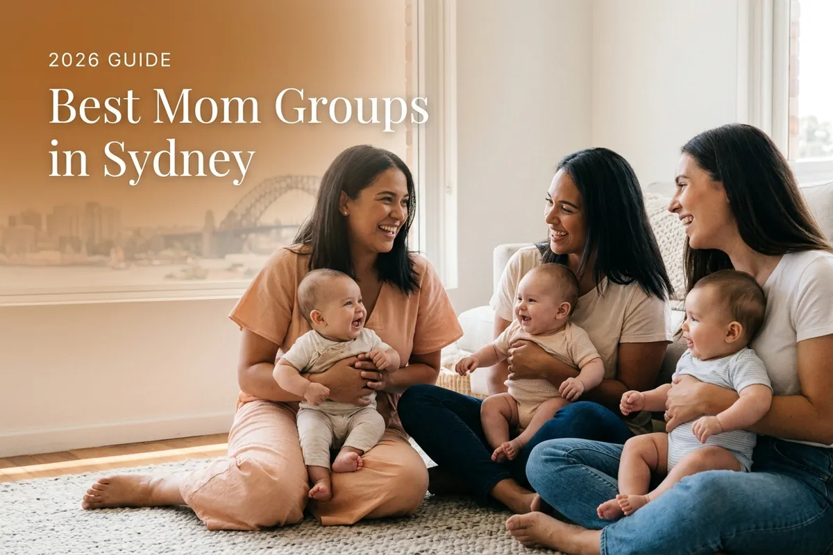 Three diverse moms holding their babies at a welcoming mom group meetup in Sydney, with the Sydney Harbour skyline and bridge under bright blue daylight behind them, illustrating a guide to the best mom groups in Sydney for 2026