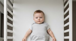 15 month old sleep schedule, baby sleeping safely on their back in a bare crib