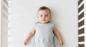 16 month old sleep schedule, baby sleeping safely on their back in a bare crib