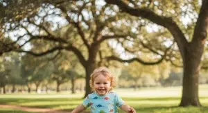 Happy 2 year old toddler running and playing outdoors