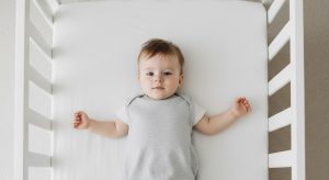 20 month old sleep schedule, baby sleeping safely on their back in a bare crib