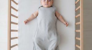 9 month old sleep schedule, baby sleeping safely on their back in a bare crib