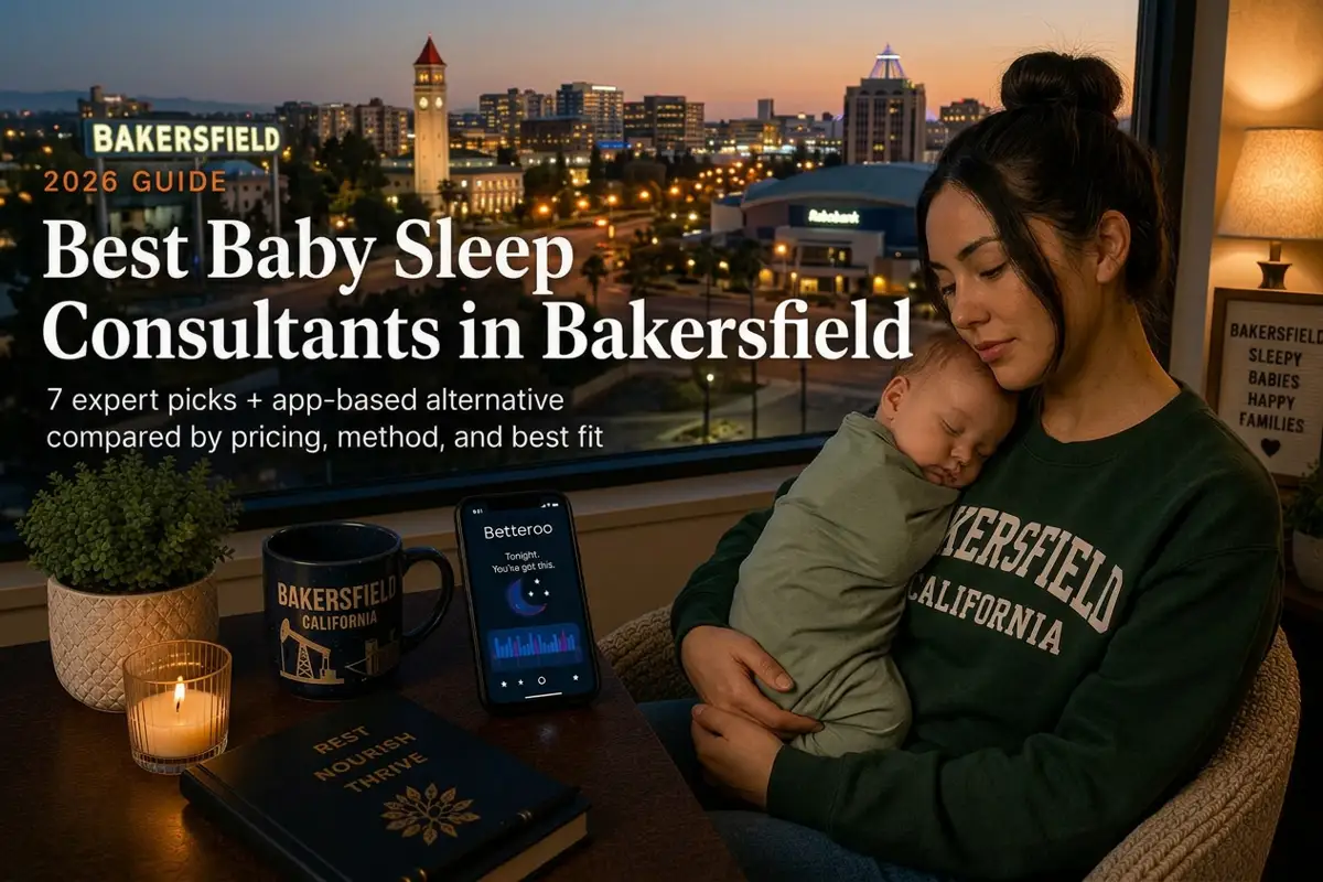 Parent holding a sleeping baby by a window at dusk, best baby sleep consultants in Bakersfield with warm city lights