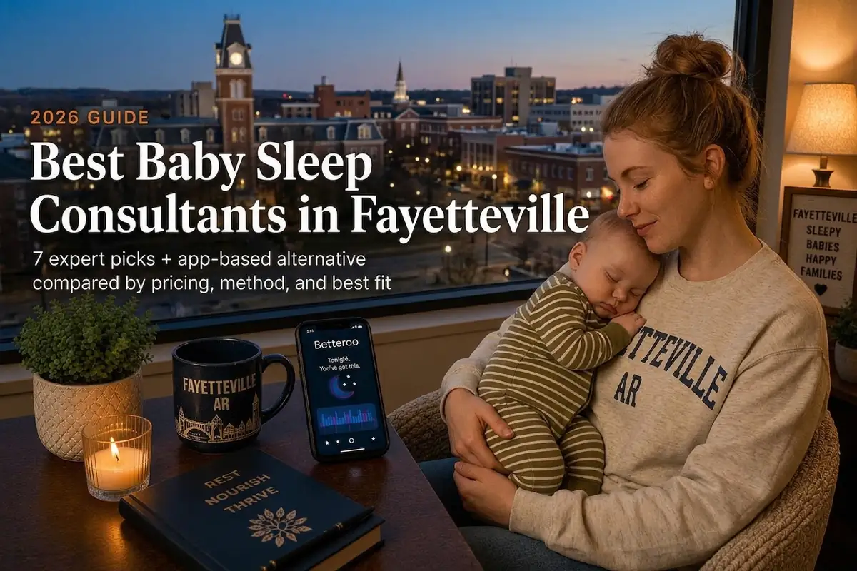 Mother holding a sleeping baby by a window at dusk, guide to the best baby sleep consultants in Fayetteville, Arkansas