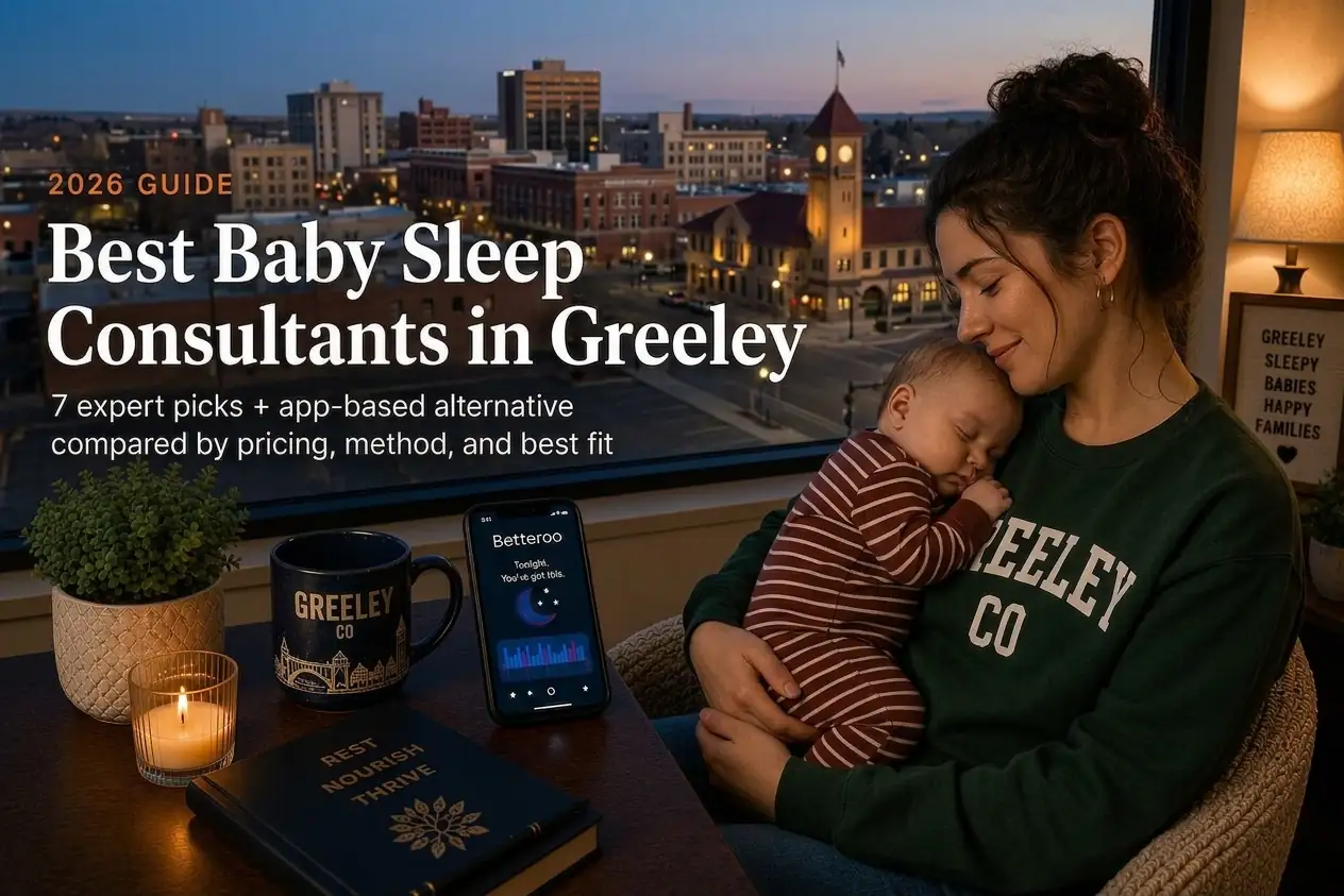 Greeley parent holding a sleeping baby by a window at dusk, our guide to baby sleep consultants in Greeley.