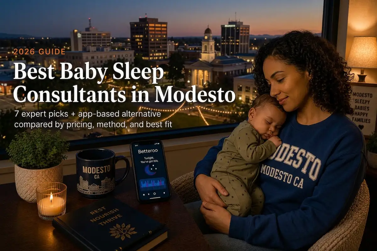 Mother holding a sleeping baby by a window at dusk, guide to the best baby sleep consultants in Modesto, California