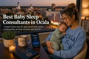 Mother holding a sleeping baby by a window over Ocala's downtown evening skyline, baby sleep consultants in Ocala.
