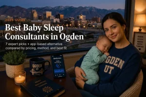 Mother holding a sleeping baby by a window at dusk, guide to the best baby sleep consultants in Ogden, Utah