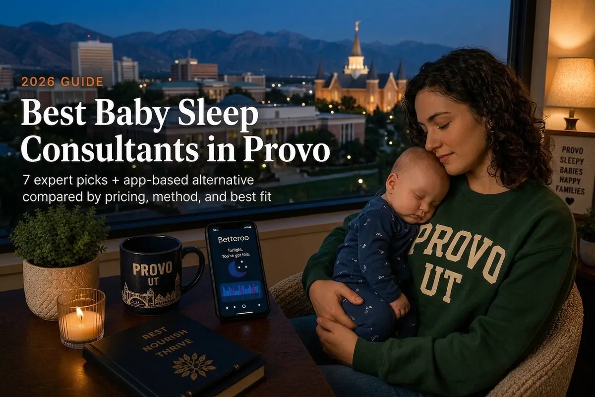 A mother cradling her sleeping baby by a window over the Provo skyline at dusk, best baby sleep consultants in Provo