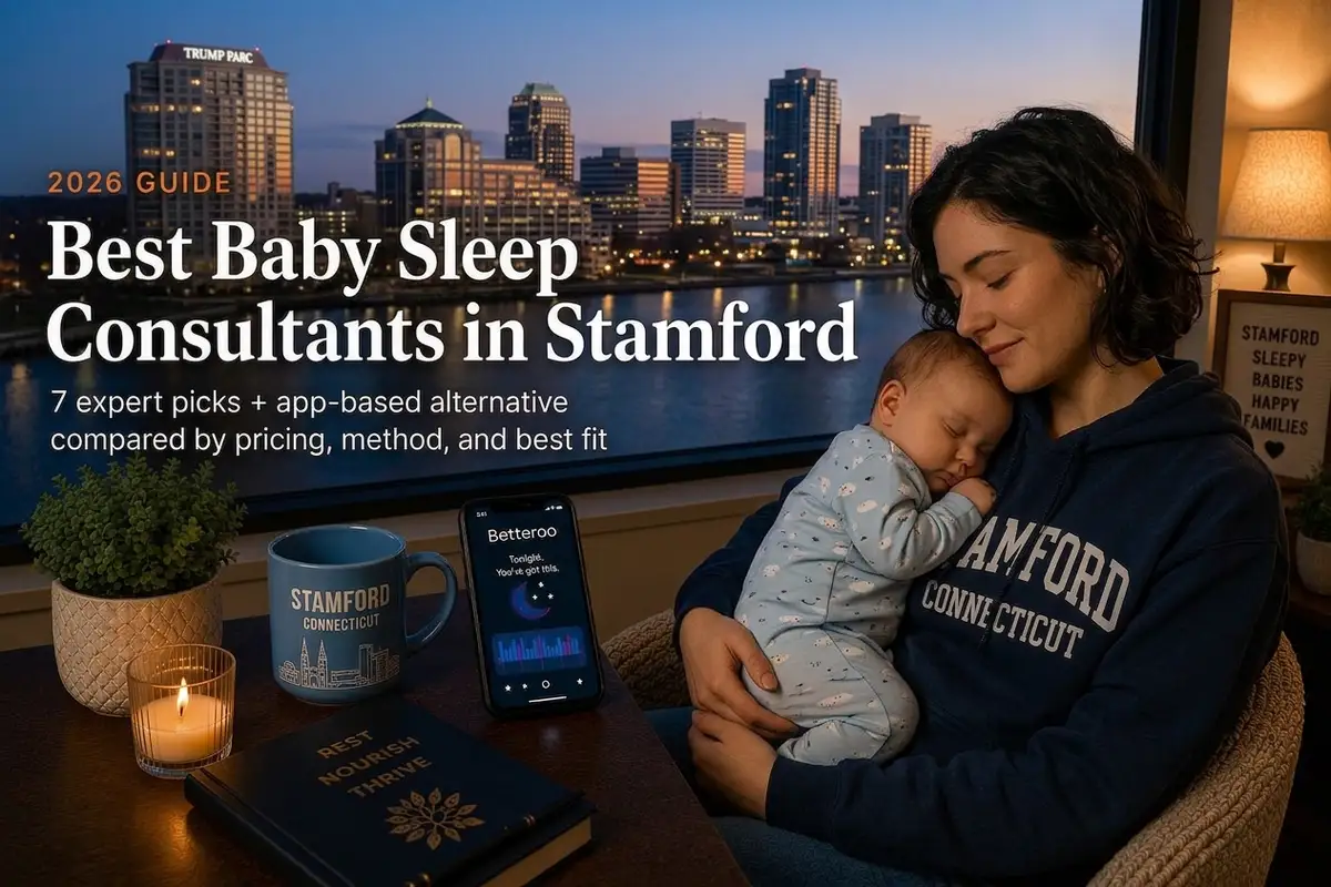 Mother holds sleeping baby by a window, guide to the best baby sleep consultants in Stamford, Connecticut