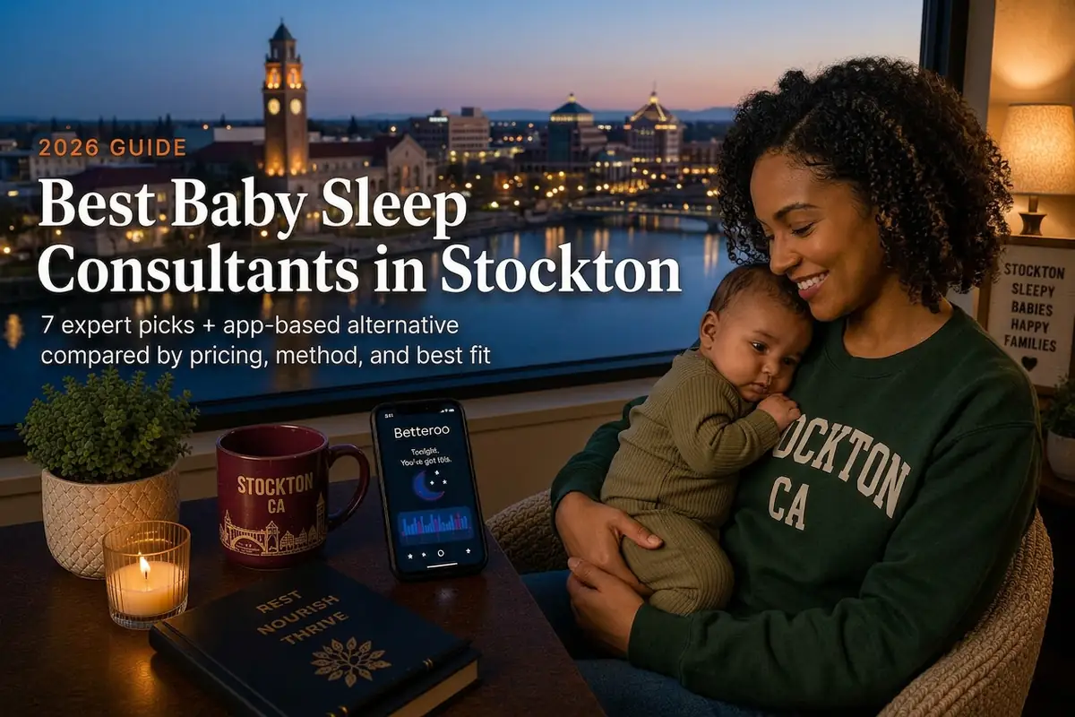 A mother cradling her sleeping baby by a window over the Stockton skyline at dusk, best baby sleep consultants in Stockton
