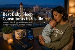 A Visalia mother holds her sleeping baby by a window at dusk, illustrating baby sleep consultants in Visalia.