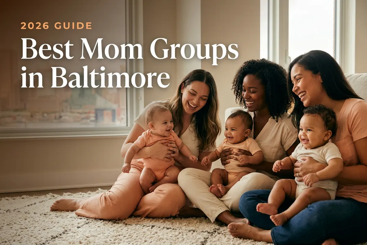 Three diverse moms holding their babies at a welcoming mom group meetup in Baltimore, with the Baltimore Inner Harbor skyline in warm daylight behind them, illustrating a guide to the best mom groups in Baltimore for 2026