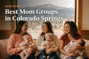 Best mom groups in Colorado Springs, CO: three moms holding their babies together at a local mom group meetup in 2026