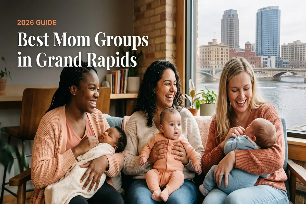 Best Mom Groups in Grand Rapids | Betteroo Three smiling mothers on a couch with their babies, by a window overlooking Grand Rapids, for the 2026 guide to best mom groups in Grand Rapids