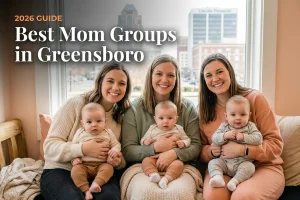 Best mom groups in Greensboro, NC: three moms holding their babies together at a local mom group meetup in 2026