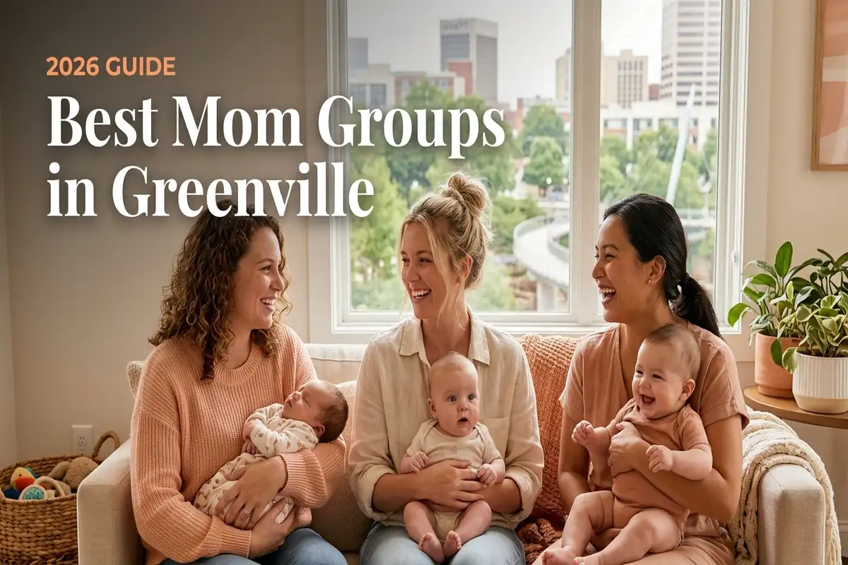Three smiling moms with babies on a cozy sofa in a bright living room, promoting Greenville's 2026 guide to the best mom groups.