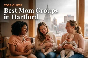 Best mom groups in Hartford, CT: three moms holding their babies together at a local mom group meetup in 2026