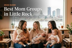 Best mom groups in Little Rock, AR: three moms holding their babies together at a local mom group meetup in 2026