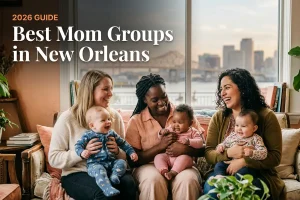 Best mom groups in New Orleans, LA: three moms holding their babies together at a local mom group meetup in 2026