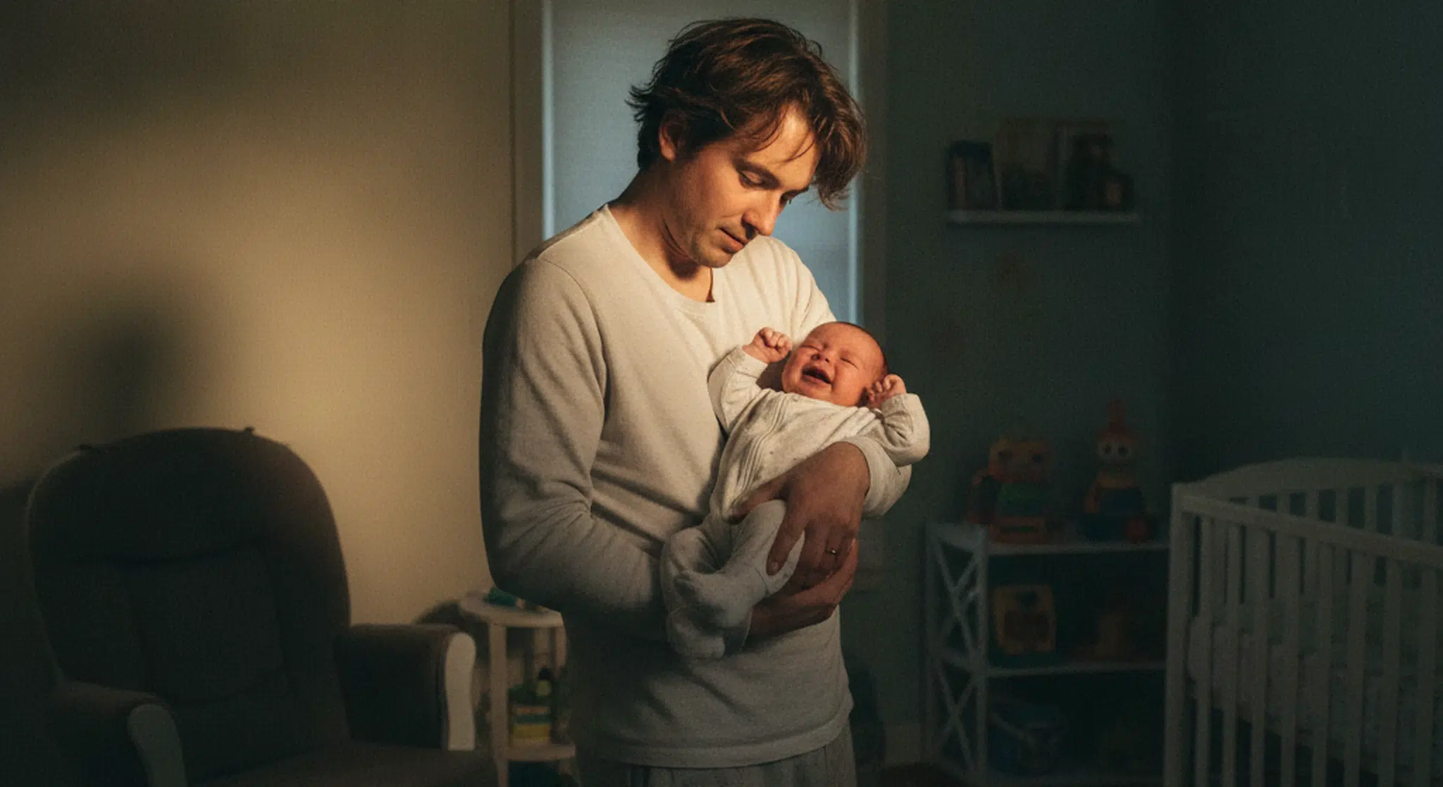 Why Do Babies Fight Sleep Common Reasons and What Helps | Betteroo Tired parent gently soothing an awake, fussy baby who is resisting sleep at night