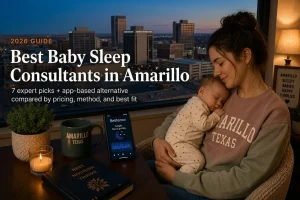 Mother holding a sleeping baby at dusk, best baby sleep consultants in Amarillo, Texas, downtown skyline behind.
