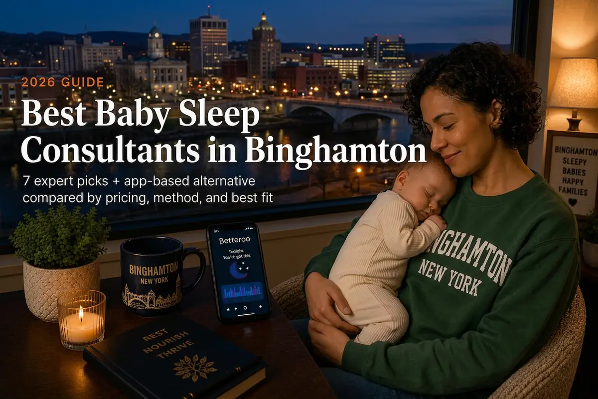 Mother holding sleeping baby at dusk researching baby sleep consultants in Binghamton with the Southern Tier skyline behind