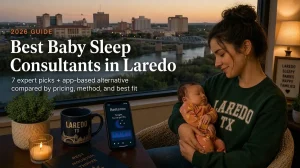 Best Baby Sleep Consultants in Laredo Tx 2026 | Betteroo Mother holding a sleeping baby by a window, guide to the best baby sleep consultants in Laredo with the Laredo skyline at dusk