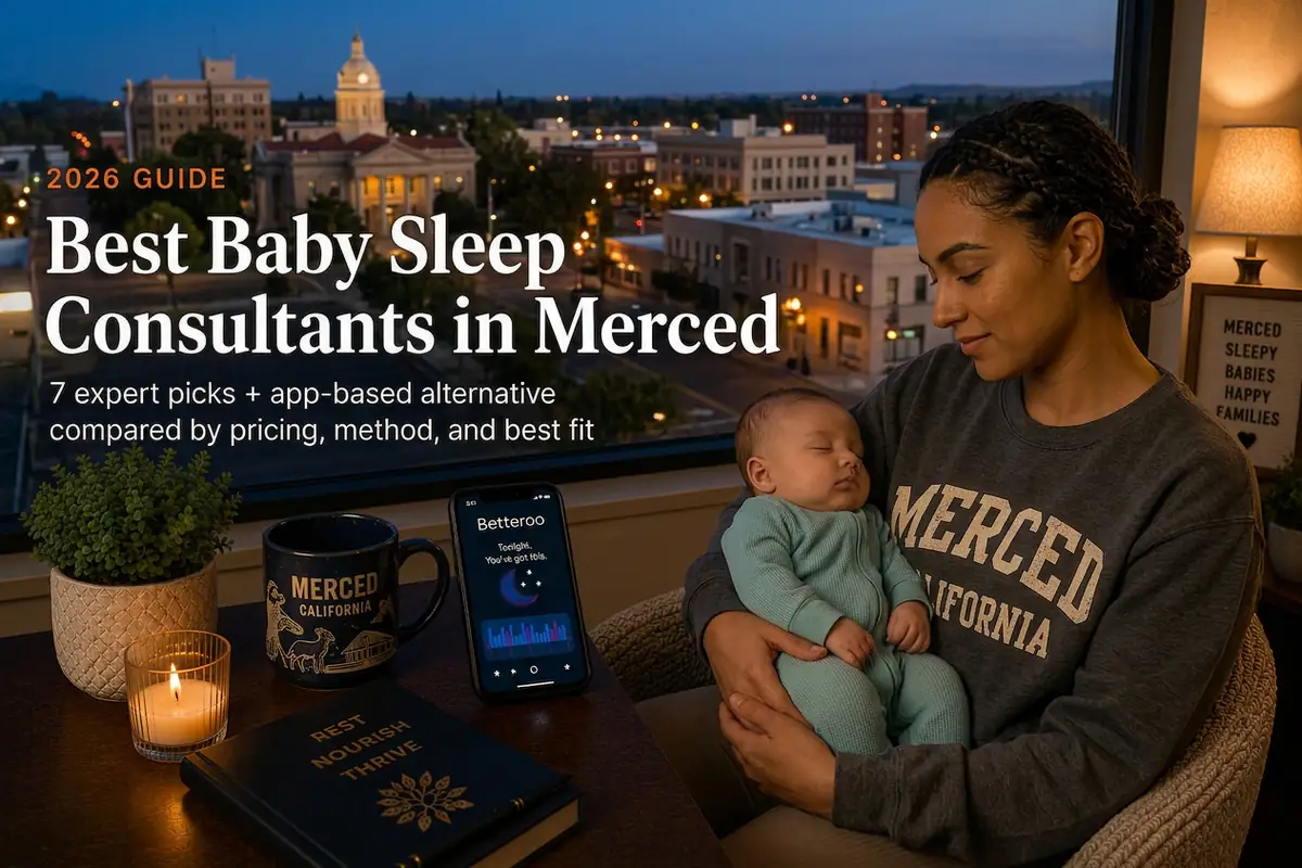 A tired mother holding a sleeping baby by a window at dusk in Merced, illustrating a 2026 guide to the best baby sleep consultants in Merced