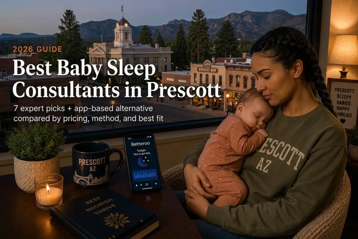 Mother holding a sleeping baby by a window over the pine-lined courthouse square, baby sleep consultants in Prescott