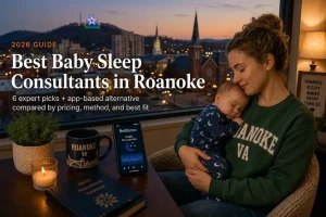 A mother holds her sleeping baby by a window overlooking the Roanoke Virginia skyline and Mill Mountain star at dusk, illustrating baby sleep consultants in Roanoke, Virginia.