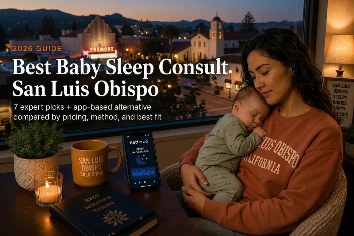 A tired mother holding a sleeping baby by a window at dusk in San Luis Obispo, illustrating a 2026 guide to the best baby sleep consultants in San Luis Obispo