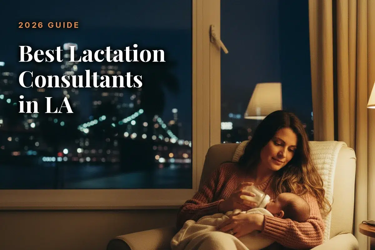 Mother feeding her baby at home in the evening, illustrating a guide to the best lactation consultants in LA