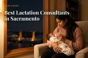 Best lactation consultants in Sacramento 2026 guide cover, mother feeding her baby beside a window with the Sacramento skyline at night