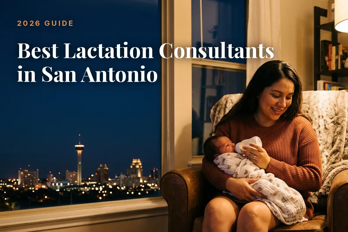 Mother holding a swaddled newborn on her lap at home by a window with city lights outside; overlay reads 'Best Lactation Consultants in San Antonio' (2026 Guide).