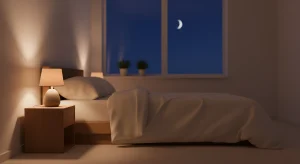 Softly lit bedroom at night with a lamp glowing beside an open window and a made bed