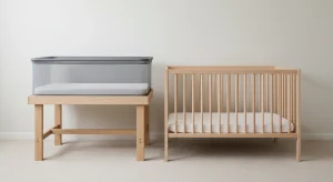 Bassinet Vs Crib Differences Safety and How to Choose | Betteroo Empty bassinet and empty wooden crib side by side in a bright nursery