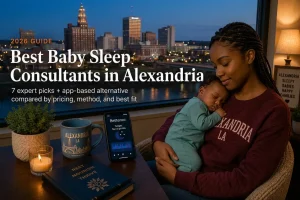 Mother holding a sleeping newborn by a window over the Red River, baby sleep consultants in Alexandria Louisiana