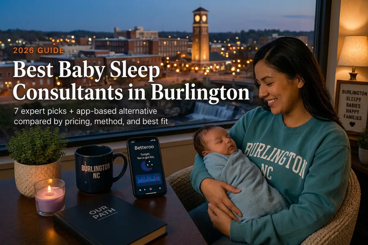 Mother holding a sleeping baby beside a window overlooking downtown brick mills and the depot clock tower, guide to baby sleep consultants in Burlington North Carolina