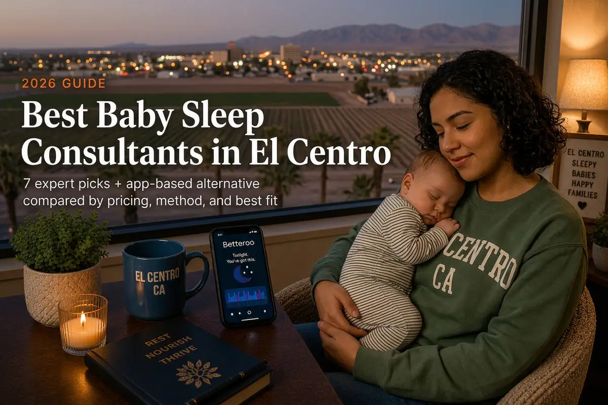Mother holding a sleeping baby beside a window overlooking Imperial Valley farmland at dusk, guide to baby sleep consultants in El Centro California
