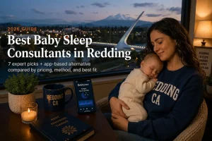Mother holding a sleeping baby beside a window overlooking the Sundial Bridge and Mount Shasta, guide to baby sleep consultants in Redding California