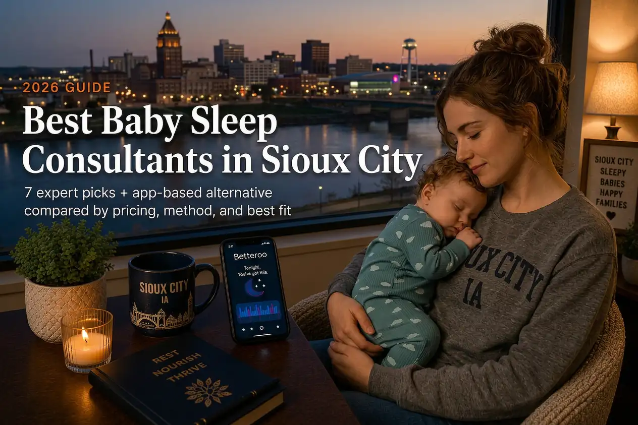 Mother holding a sleeping baby by a window overlooking the Sioux City Iowa skyline at dusk, guide to baby sleep consultants in Sioux City
