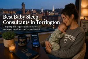 Mother cradling a sleeping baby at dusk above Litchfield hills, a guide to baby sleep consultants in Torrington