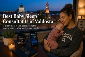 Mother holding a sleeping newborn beneath south Georgia pines at dusk, guide to baby sleep consultants in Valdosta