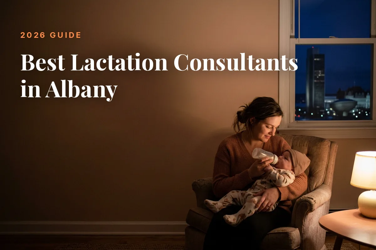 Mother feeding her baby at home in Albany at night, cover image for the Betteroo guide to the best lactation consultants in Albany in 2026