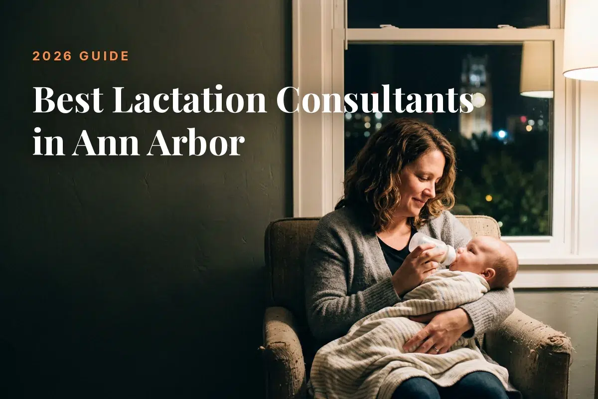 Mother feeding her baby at home in Ann Arbor at night, cover image for the Betteroo guide to the best lactation consultants in Ann Arbor in 2026